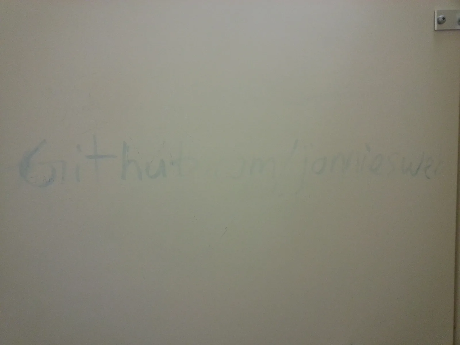 github.com/jonniesweb written in a bathroom stall